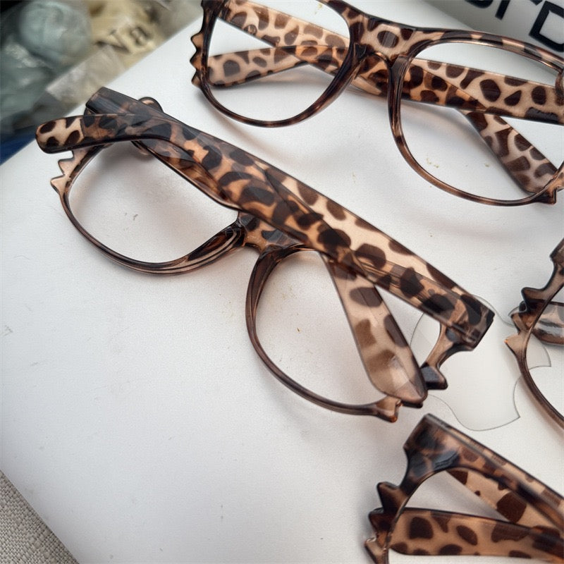 Leopard print retro eyeglass frames, classic Kitty-style cute tortoiseshell color, subculture aesthetic — sweet yet edgy, perfect effortless look enhancer.