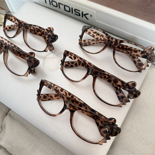 Leopard print retro eyeglass frames, classic Kitty-style cute tortoiseshell color, subculture aesthetic — sweet yet edgy, perfect effortless look enhancer.