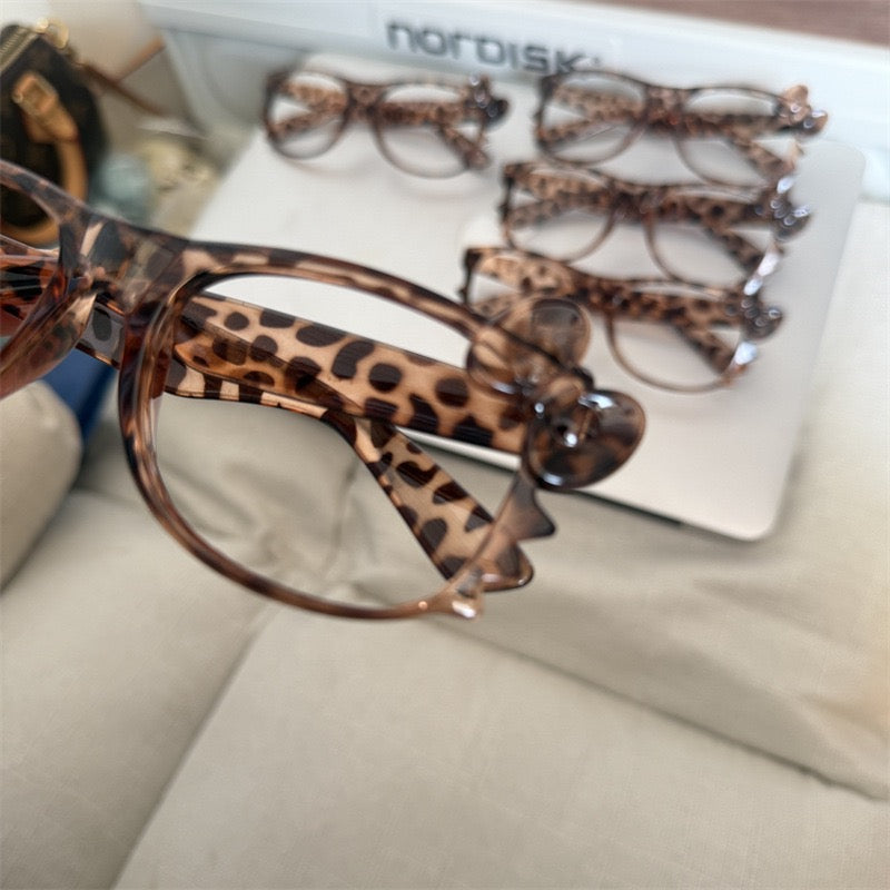 Leopard print retro eyeglass frames, classic Kitty-style cute tortoiseshell color, subculture aesthetic — sweet yet edgy, perfect effortless look enhancer.